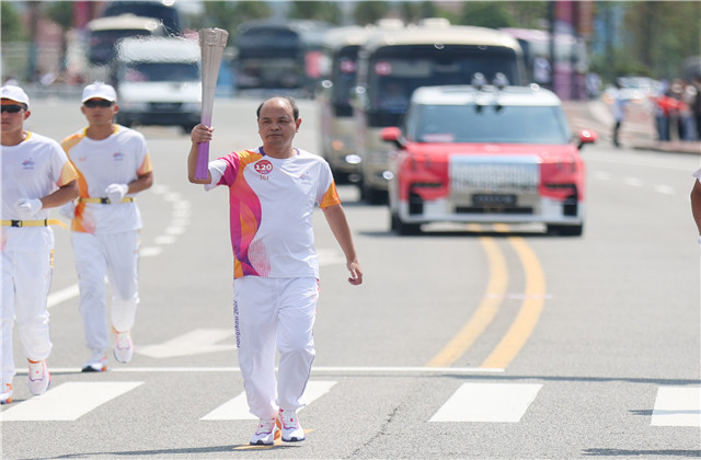 亚运火炬手韦晓青：参与“大莲花”建设，传递火炬一生难忘